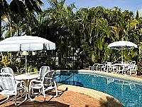 Pool area surrounded by tropical gardens Pool area surrounded by tropical gardens