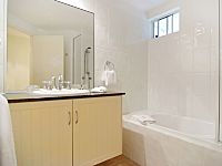 Bathroom with shower over bath Bathroom with shower over bath