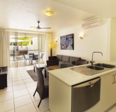 Port Douglas Resorts - Apartment Kitchen and Living Areas opening out to Patio | Port Douglas Apartments Port Douglas Resorts - Apartment Kitchen and Living Areas opening out to Patio | Port Douglas Apartments
