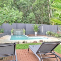 Relax Poolside with Spa jets, waterfall & Rainforest Backdrop | Palm Cove Holiday House 