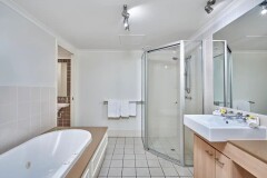414 Private Apartment Palm Cove Main Bathroom with Spa Bath & Shower