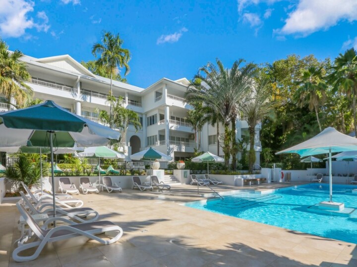 Relax Poolside in the Main Resort Pool - Alamanda Palm Cove by Lancemore