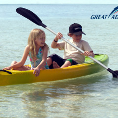Children and families love kayaking around Green Island on a day trip to the Great Barrier Reef in Australia
