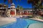 Enjoy a refreshing dip in the large lagoon style swimming pool -  Private Palm Cove Holiday Apartment