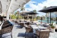 Enjoy alfresco dining with views of the Lagoon Swimming Pool | Novotel Oasis Resort Cairns