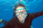 Happy snorkeller on our Great Barrier Reef tour from Cairns in Queensland Australia