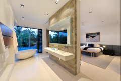 Master Bedroom complete with freestanding bath tub overlooking the wet edge pool and views beyond