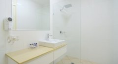 Modern Bathroom Facilities with Monsoon Rain Shower - Cairns Queenslander Hotel & Apartments