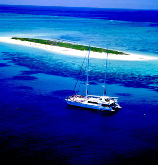 Aerial view of our luxury yacht morred at Michaelmas Cay