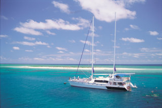 Aerial view of luxury catamaran at Michaelmas Cay