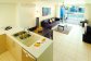 Port Douglas Resorts - Apartment Kitchen and Living Areas opening out to Patio | Port Douglas Holiday Apartments