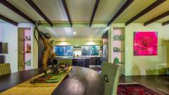 Open plan dining and living areas in your private Palm Cove Holiday Home