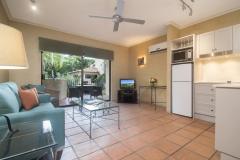 Open plan living area opening out to private balcony/patio - Villa San Michele Apartments Port Douglas