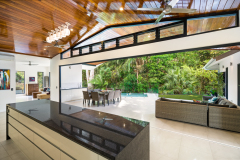 Spacious kitchen flowing outdoors - Palm Cove Accommodation 