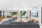 Open plan living flowing out to the poolside and beachfront lawn | Palm Cove Beachfront House