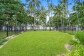 Large fenced lawn out to the beach | Palm Cove Beachfront House