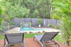 Relax Poolside with Spa jets, waterfall & Rainforest Backdrop | Palm Cove Holiday House 