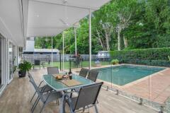 Poolside dining with kids cubby house - Clifton Beach House | Cairns Beach Accommodation