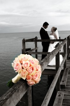 Port Douglas Sugar Wharf photo shoot with wedding couple and bouquet