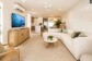 Relax in the spacious living area - Palm Cove Beachfront Suite  