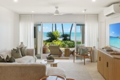Spacious living with beachfront views at Palm Cove.