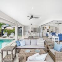 Large Outdoor patio with Lounge, Dining and BBQ by the pool - Trinity Beach Beach House | Cairns Beach Accommodation